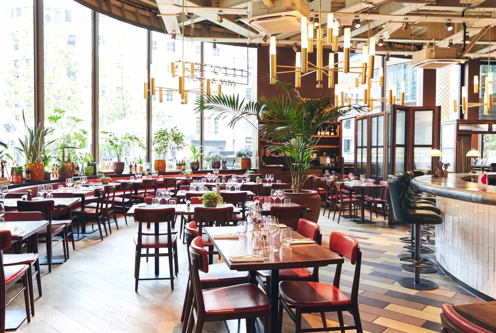 Bright premium restaurant dining room with plants